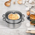 Multi-Function 5-Layer Stainless Steel Steamer for cooking with layered soups and kitchen utensils.