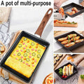 Nonstick Tamagoyaki Japanese omelette pan with wooden handle, cooking various dishes including omelette, vegetables, and sandwiches